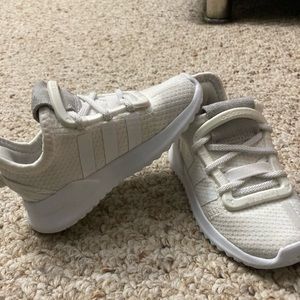 Baby boy used white adidas sneakers